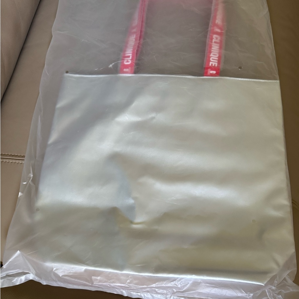 Clinique Silver Tote with Red Logo Handles